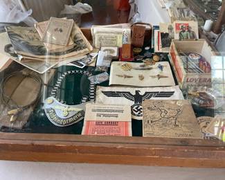 This showcase contains Military Items from the Civil War, WWI, and WWII.