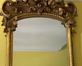 This is the Chippendale mirror with gold leaf frame with rope border and heavy carving at the top 36" x 82" Circa 1880.