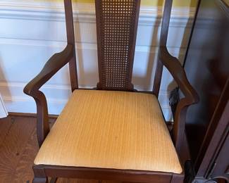Set of 6 mahogany dining chairs, with 1 host chair as shown. with caned panel in center of backs and silk brocade upholstered seats