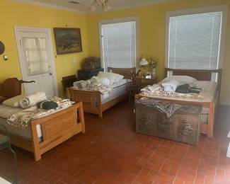 Here is the pool house with the A. Brandt Ranch Oak 2 twin beds, and one matching full size bed with mattresses. The 2 matching bedside tables are in there also. The garage is thru that door on the left.