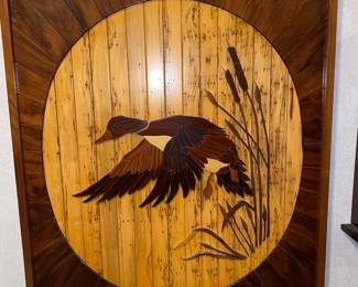 Artistic wooden duck in flight art