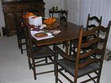 This cherry table is actually a drop leaf table.