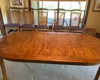 Drexel dining room table with 2 leaves and 6 chairs.