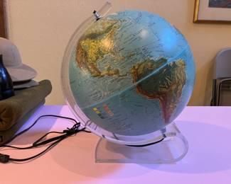Cool light up globe on Lucite stand.