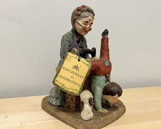 Lot 58 | Arnart Porcelain Seamstress Mending Figurine
