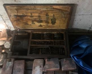 Bricks from Maumee Street, A box with a machine with parts