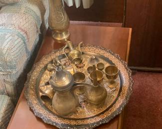 Side table with brass items