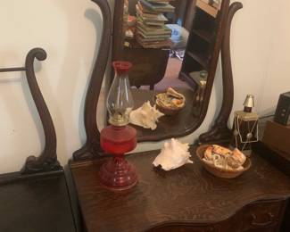 Antique dresser with mirror, oil lamp, shells
