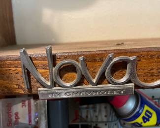 Several vintage car emblems.