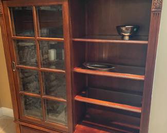 Another view of the Ethan Allen bookcase with glass sliding doors and shelves, with 3 lower drawers