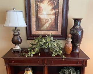 Console table with 2 drawers and shelves by Thomasville; framed print, lamp, urns, and faux plants