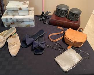 Decor boxes and metal vanity covered dishes, metal candle holder, Kate Spade sandals, and Ferragamo ivory mules, leather cross-body and silver with metal cross-body bag