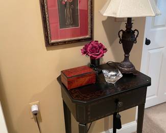 Black side table, framed print, Orrefors candle holder, lamp and more