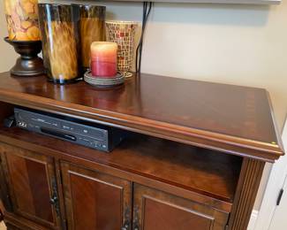 Media console cabinet with shelf and 3-door cabinets below by Thomasville