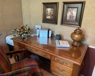 Desk with glass protective top by Ethan Allen, and swivel office chair with nailhead trim, ipod docking stations and large urn