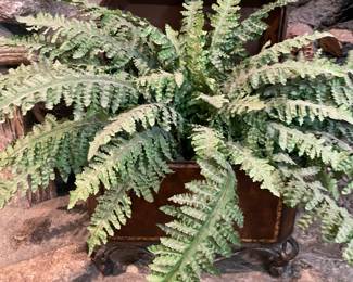 Faux plant in metal planter
