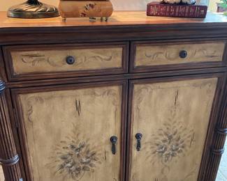 Another view of the entryway console cabinet and hand-painted details