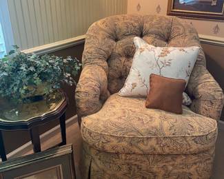 Accent upholstered chair by Ethan Allen, black scolloped side table with brass tray, faux plants, framed prints, and occasional pillows