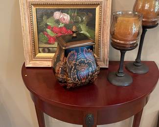side console table/entryway table with framed acrylic, metal/glass pillar candle holders, and urn