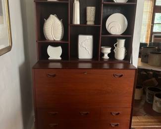 Danish cabinet with cream pottery by McCoy, Red Wing, etc. 