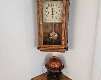 Howard Miller clock and corner oak cabinet 
