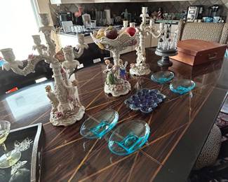 Stunning long dining table with upholstered wingback chairs at each end