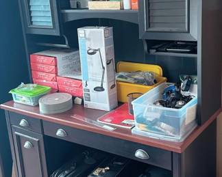 desk with hutch and office supplies