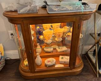 Curio Cabinet with Decor Pieces and Jewelry on Top