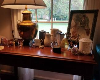 Mahogany desk with assortment of collectibles. 
