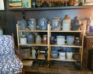 First level family room filled with antique crocks, pottery and more.