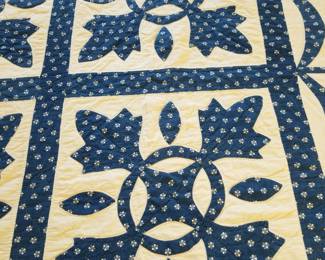 Blue and white swag and tassel quilt. 