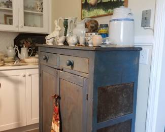 Early E TN pie safe with original tins.
Located in kitchen.