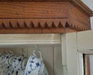 I love the sawtooth molding detail of this early cabinet. 