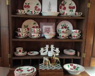 Desk filled with West Virginia pottery.