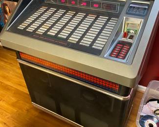 WORKING!! Rowe AMI 200 Juke Box FULL of  records, PLUS an entire tote full of additional 45s.   I have been enjoying using it during setup and it sounds great! This item is available for presale. Please reach out for additional information.