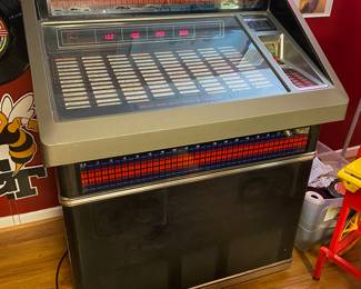 WORKING!! Rowe AMI 200 Juke Box FULL of  records, PLUS an entire tote full of additional 45s.   I have been enjoying using it during setup and it sounds great! This item is available for presale. Please reach out for additional information.