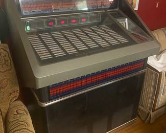 WORKING!! Rowe AMI 200 Juke Box FULL of  records, PLUS an entire tote full of additional 45s.   I have been enjoying using it during setup and it sounds great! This item is available for presale. Please reach out for additional information.