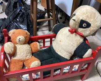 bears in a doll bed