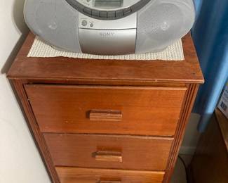 small cabinet and boombox
