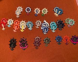 About 3 dozen Austin Aqua Fest skipper pins
