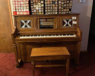 player piano and rolls
