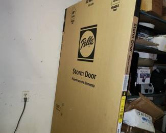 NEW IN BOX Pella storm door (1) and screen doors (2)