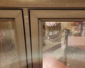 new in box Pella metal framed, wind-out double window, close up detail, tan in color