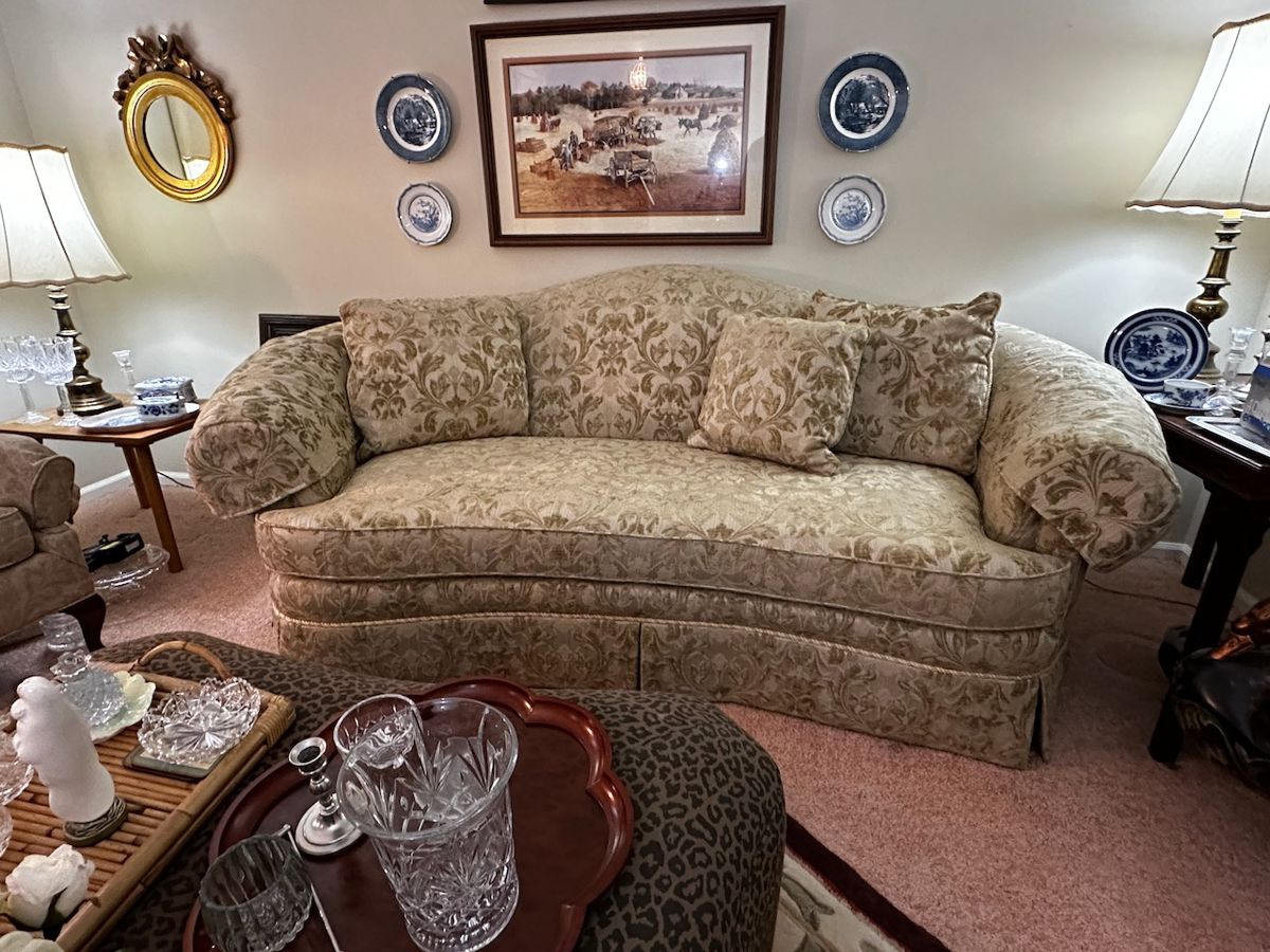 Lots of beautiful items including signed and numbered prints from Jack DeLoney.  Curved sofa is made in USA from Sherrill.