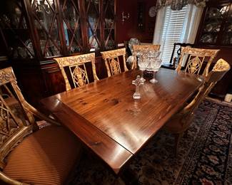 A few Waterford crystal pieces sits upon a vintage Ethan Allen "Old Tavern" table.