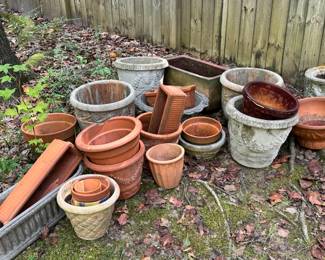 Gardening pots, some concrete, some clay.