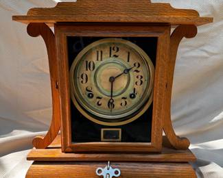 Ingram eight-day mantle clock.  Pendulum swings but could use a little maintenance. 