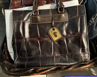 Lots of handbags and purses.  Dooney & Bourke, Brighton, Coach, Vera Bradley are among the featured.