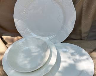 Sets of English Wedgwood bone china in Strawberry & Vine pattern.