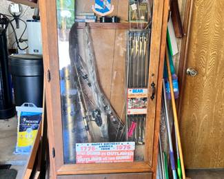 Gun cabinet, fishing rods, archery
